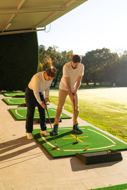 istock Friends playing golf together in a court 1815275385