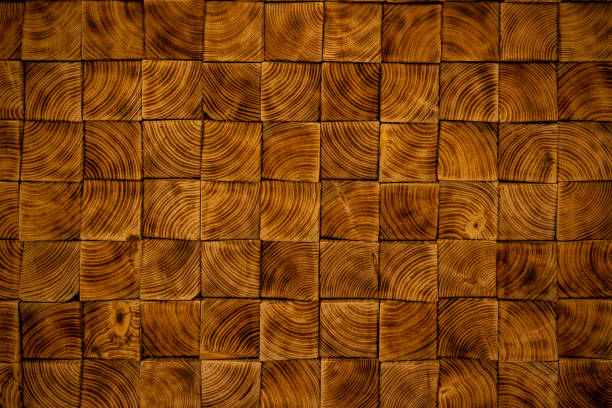 istock Rectangular wood cut-outs or blocks forming a roof. Beautiful wood texture made from different chunks of square wood. 1815284514