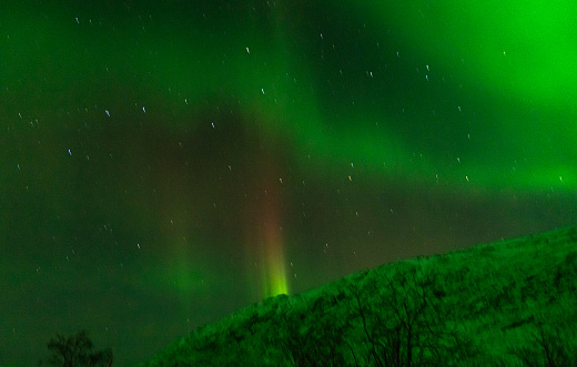 View of the northern lights near Tromso city in the north of Norway.