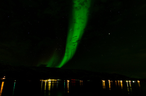 View of the northern lights near Tromso city in the north of Norway.
