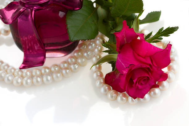 istock pink rose with pearl necklace 181533893