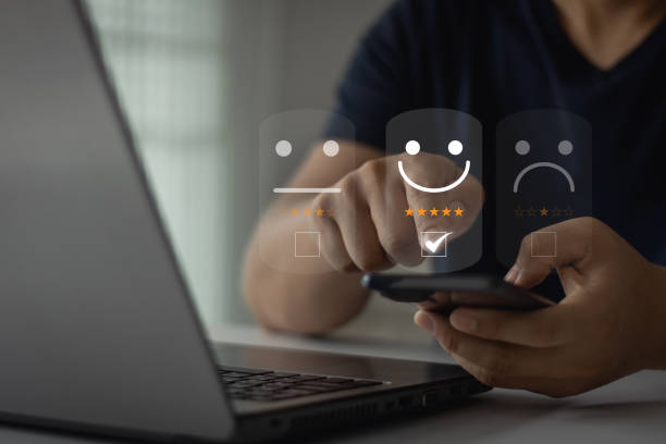 istock Client satisfaction review research survey concept. User hand pressing on smartphone screen with gold five star rate feedback an online app. Customer service best excellent business rating experience. 1815341998