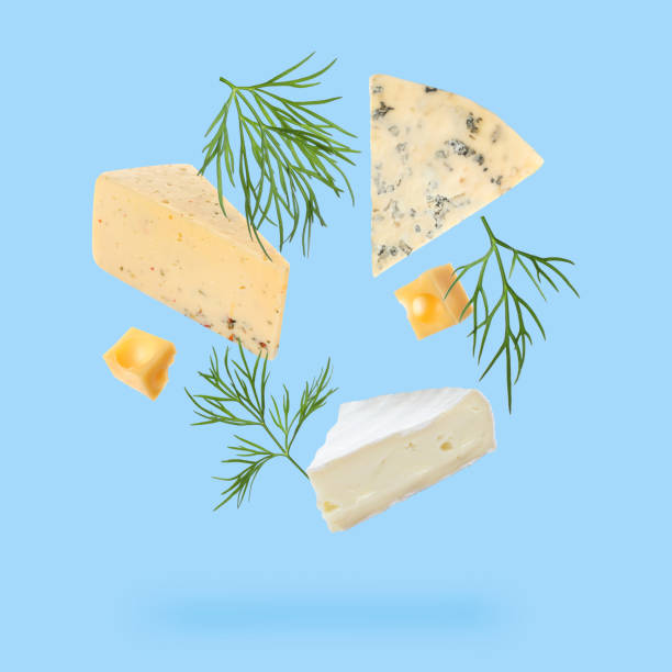 istock Different kinds of cheese and dill falling on light blue background 1815390357