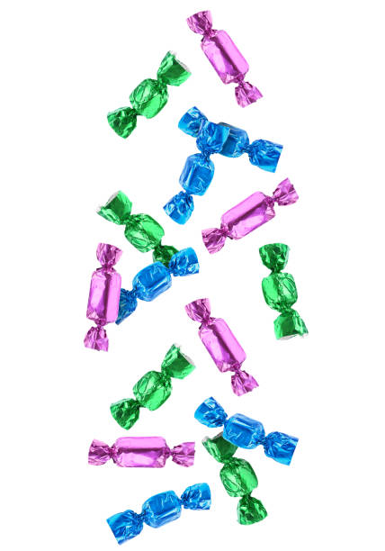 istock Tasty candies in bright wrappers falling on white background 1815390930