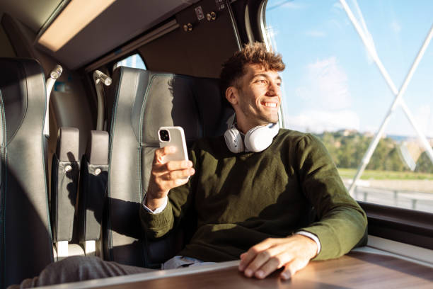 istock A quick and modern way of transportation. A young man traveling by train. 1815394049