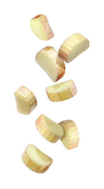 istock Pieces of fresh ripe rhubarb falling on white background 1815410774