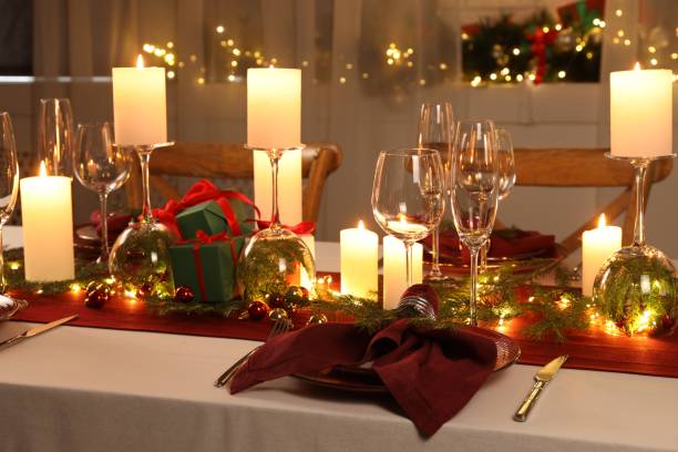 istock Christmas table setting with burning candles and festive decor 1815423698
