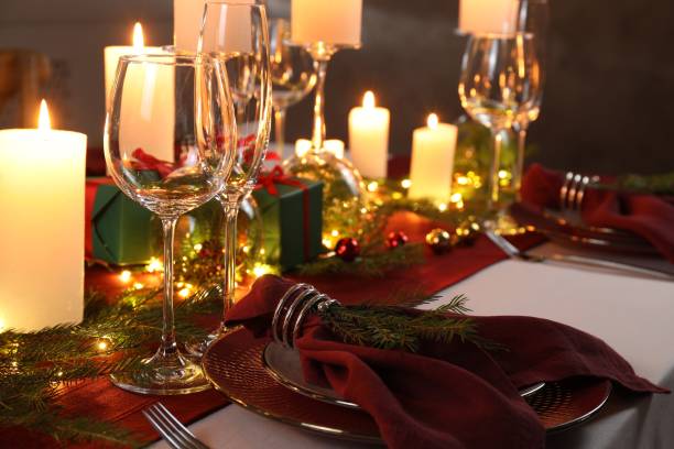 istock Christmas table setting with burning candles and festive decor 1815423728