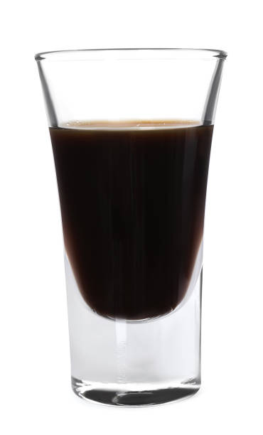 istock Shot glass with coffee liqueur isolated on white 1815424271
