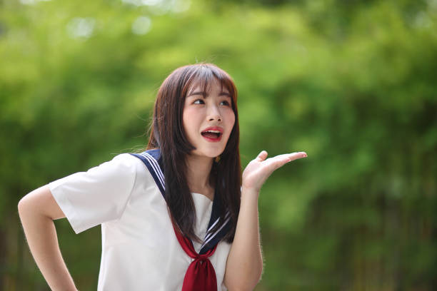 istock Japanese high school student with happy and shouting on copy space in bamboo background 1815424852