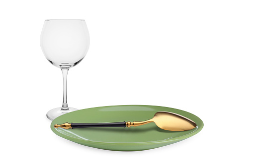 Clean plate, spoon and glass on white background
