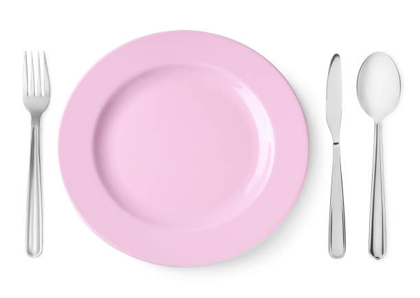 istock Empty pink plate with fork, knife and spoon on white background, top view 1815425921