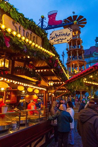 Crowded Christmas market and beautiful decorated shops and cobalt blue sky in Dresden city,Germany