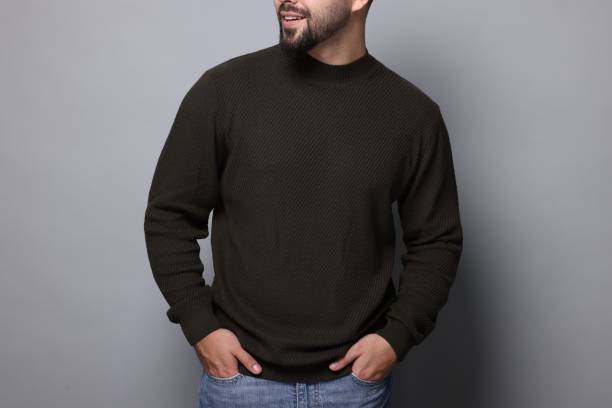 istock Man in stylish sweater on grey background, closeup 1815470009