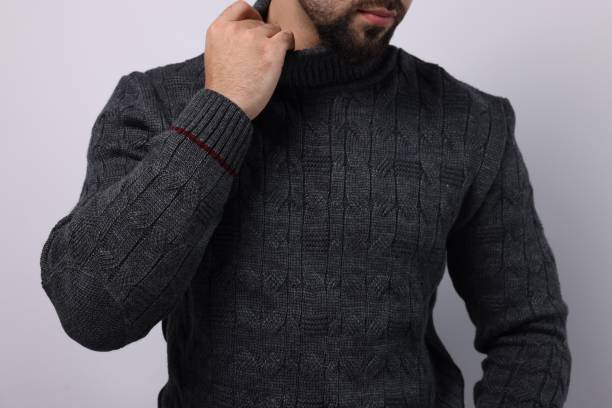 istock Man in stylish sweater on white background, closeup 1815470354