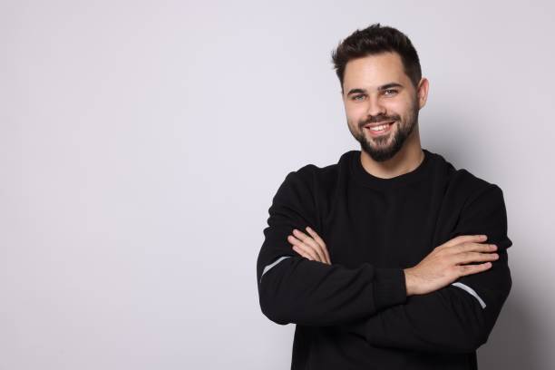istock Happy man in stylish sweater on white background, space for text 1815470521