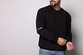Man in stylish sweater on white background, closeup. Space for text