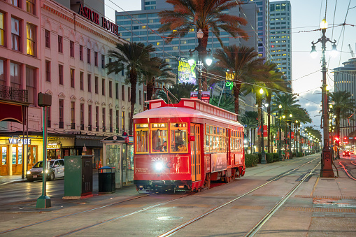 New Orleans, USA - October 25, 2023: people in New Orleans use the street car in late evening.