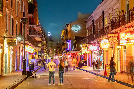 New Orleans, USA - October 24, 2023: Pubs and bars with neon lights in the French Quarter, downtown New Orleans.