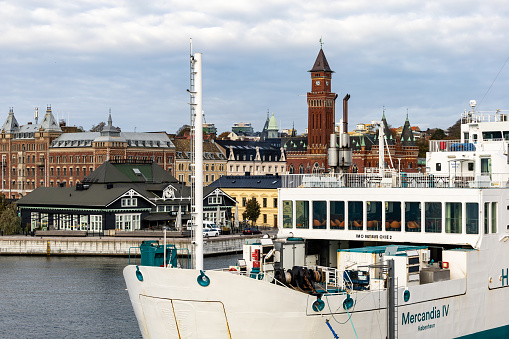 Helsingborg, Sweden Oct 30, 2023 The Helsingborg skyline and a ferry in the port going to Denmark.