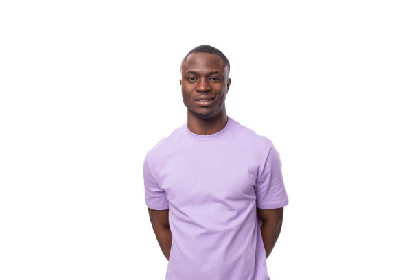 istock young handsome american man dressed in a lilac t-shirt on a white background 1815502880