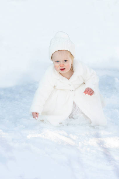 Love romantic winter photoshoot. Blonde beautiful pretty Caucasian European woman, girl in stylish clothes,fur leopard print coat, black hat. Cold winter frost weather. Street city walking,having fun.