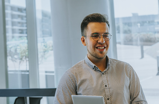 In this elegant portrait, a young businessman exudes confidence and professionalism as he smiles and gazes at the camera. The backdrop is a creatively designed luxury office space, adding a touch of sophistication to the image. The digital tablet in her hands signifies modern work practices, while the overall ambiance conveys a dynamic and stylish corporate atmosphere.
Young businessman, portrait, confidence, professionalism, luxury office, digital tablet, creative workspace, corporate ambiance, stylish, modern work practices