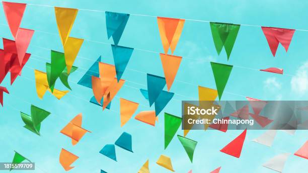 Fair Flag Bunting Colorful Background Hanging On Blue Sky For Fun Fiesta Party Event Summer Holiday Farm Feast Celebration Carnival Festival Event Park Or Street Festa Design Decoration Stock Photo - Download Image Now