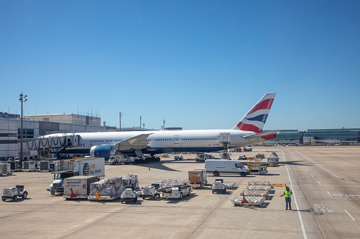 Houston, USA - October 20, 2023: British airways aircraft 777 at the george bush airport in Houston at the gate ready for loading.