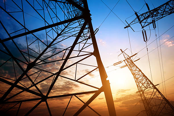 Ground level view of high-voltage pylons stock photo