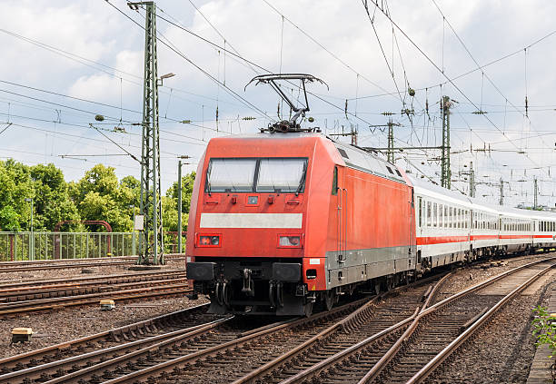 istock Electric locomotive with passenger train on Cologne station, Ger 181559865