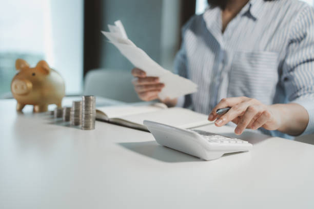 istock The operator is checking the purchase receipt, Finance employees are calculating various expenses to record in the system, Receive a receipt from the purchasing department and verify its accuracy. 1815606037