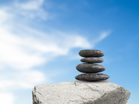Stone Zen Stack on Blue Sky Nature View Background Calm Spa Stability Balance Massage Aroma Relax Harmony Concept, Japan Garden Pebble Tower Pile Perfect Peace.