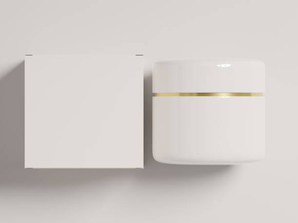 istock Flatlay of a glossy cream jar with packaging box on a white background 1815669636