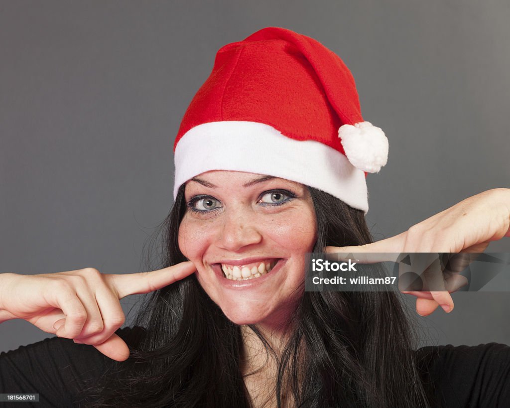 Fröhliche Frau mit Weihnachtsmütze - Lizenzfrei Eine Frau allein Stock-Foto