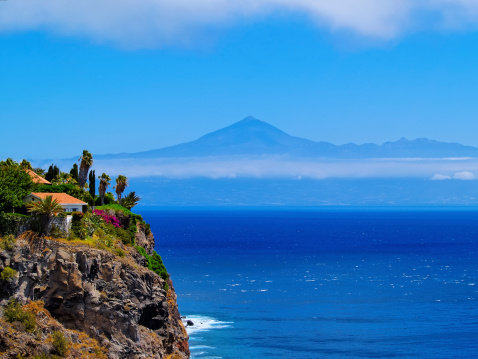 Coast of La Gomera with Teide mountain in the background, Canary Islands, Spain