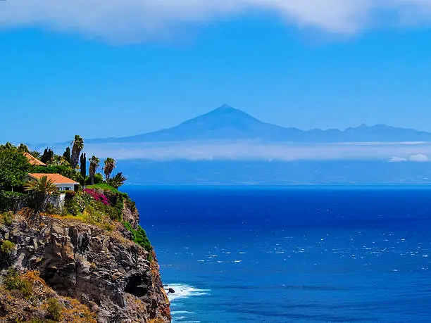Coast of La Gomera with Teide mountain in the background, Canary Islands, Spain