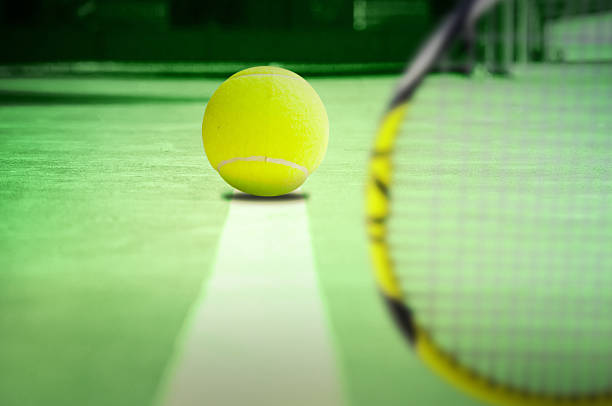 istock Tennis ball on the line 181568899