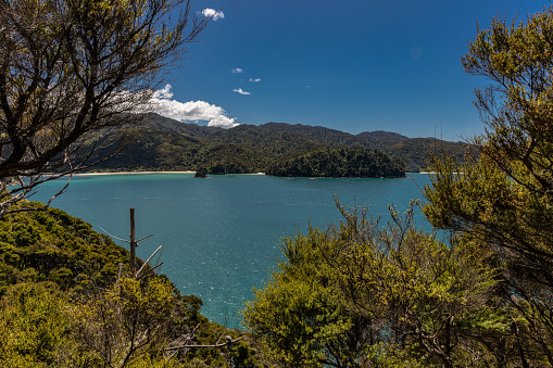Abel Tasman National Park lies in the North of New Zealand's South Island. It is renowned for its many sandy beaches and clear turquoise bays which are linked by a long and winding Coastal Track popular with hikers and ramblers