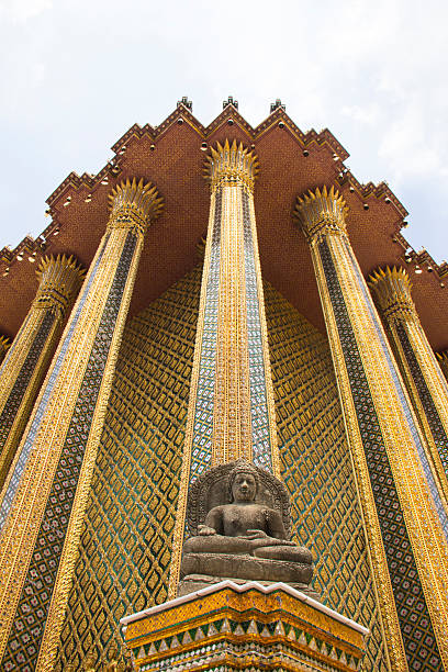 istock stone Buddha in front of Thai architect, Wat Phra Kaew 181572998