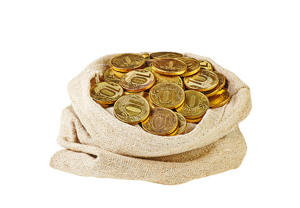 istock Canvas bag filled with coins. A white background. 181573291