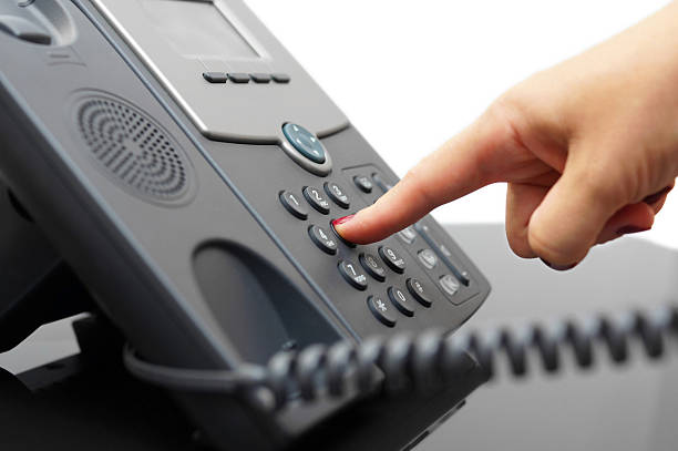 istock woman hand is dialing a phone number 181574993