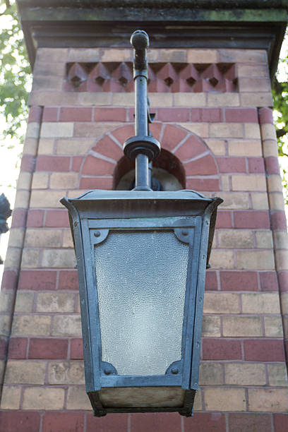 istock Metal lantern on a brick wall with glass 181575131
