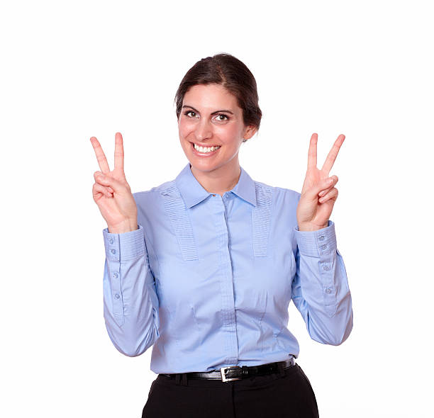istock Charming young woman standing with victory sign 181575910