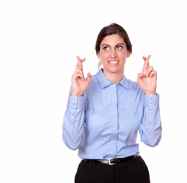 istock Lovely young woman standing with luck gesture 181581200