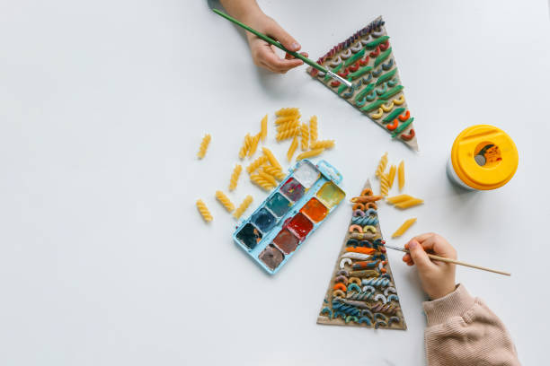 Sensory creative activity for children, child coloring pasta