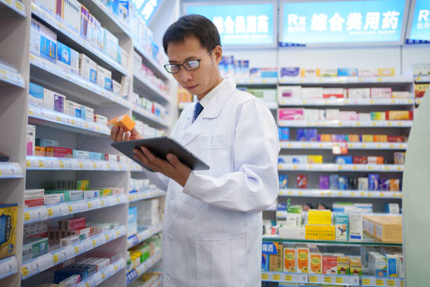 istock Male employee checking drug store products 1815842443