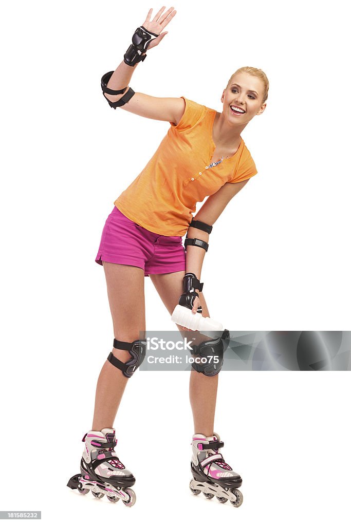 Mujer en rollerblades agitando la mano. - Foto de stock de 20 a 29 años libre de derechos