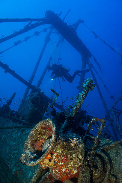 istock fishingboat wreck with winch and diver 181585686
