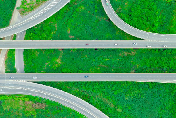 istock Cars on forest roads and elevated traffic intersections, modern road design travel concept for the environment 1815889113